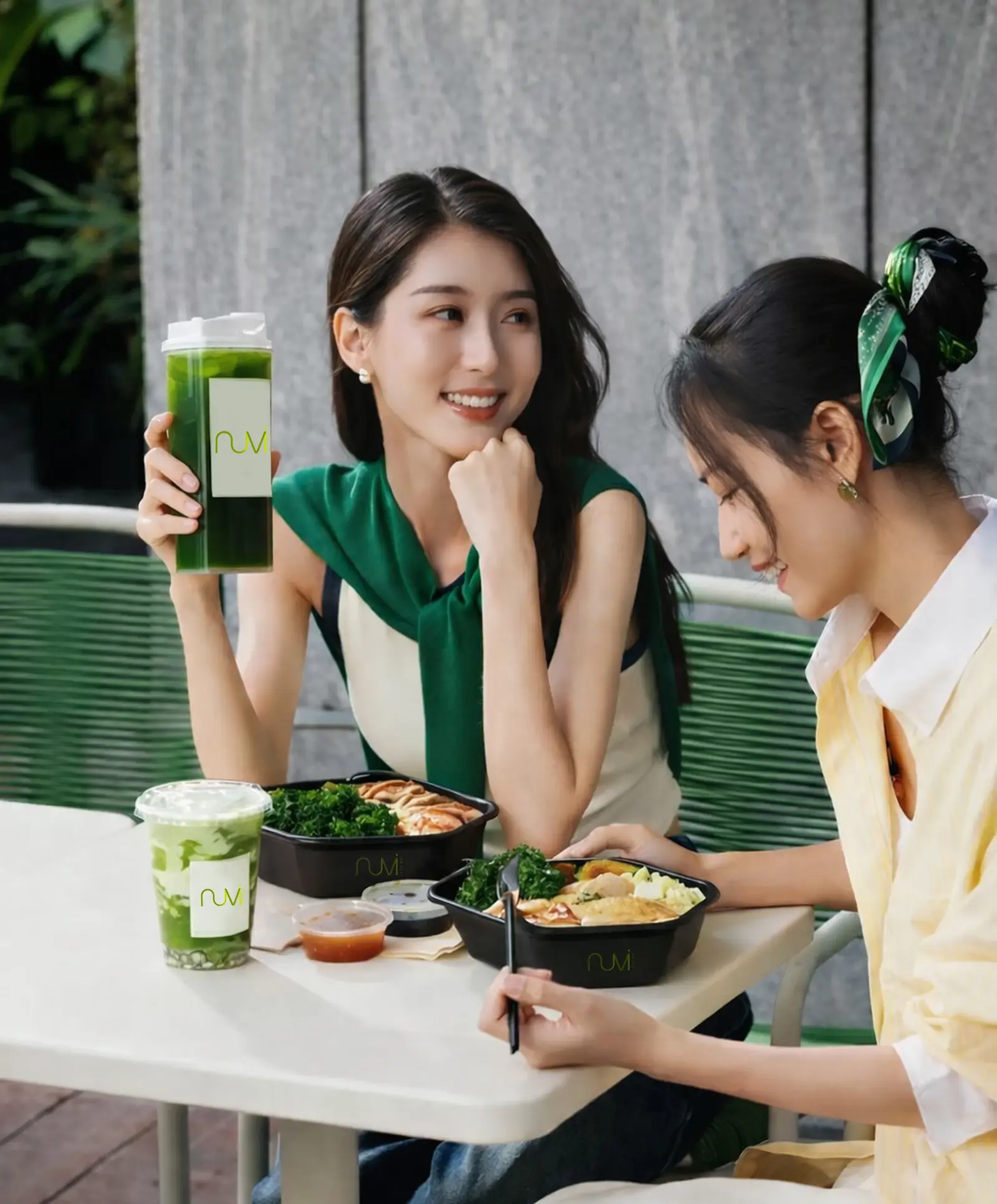 Two women enjoying Nuvi meals